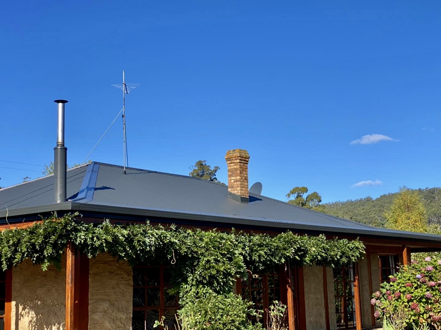 Country home with new charcoal corrugated metal roof