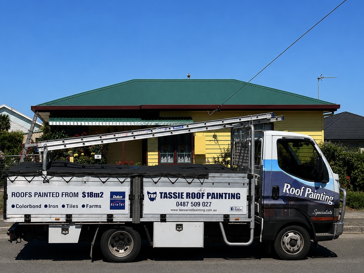 Tassie Roof Painting truck parked on a Tassie street with a green-roofed yellow weatherboard house behind. Side panel reads ROOFS PAINTED FROM $18m². Colorbond, iron, tiles, farms.